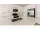 Bright kitchen featuring stainless steel appliances, white cabinets, quartz countertops, and subway tile backsplash at 18189 W Hess St, Goodyear, AZ 85338