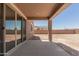 A covered patio overlooks the backyard, accessed through sliding glass doors at 18189 W Hess St, Goodyear, AZ 85338