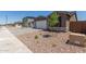 A neighborhood street with a view of well-maintained single-story homes and desert landscaping at 18189 W Hess St, Goodyear, AZ 85338