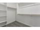Walk-in closet with shelving and bar for plenty of storage at 18189 W Hess St, Goodyear, AZ 85338