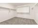 Spacious walk-in closet with shelves and carpeted floor at 18189 W Hess St, Goodyear, AZ 85338