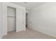Cozy bedroom with sliding closet, carpeted flooring, and fresh white walls at 18195 W Hess St, Goodyear, AZ 85338