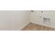 Laundry area with hookups and tile flooring at 18195 W Hess St, Goodyear, AZ 85338