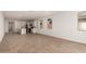 Bright and airy open-concept living space adjoining the kitchen and dining areas at 18195 W Hess St, Goodyear, AZ 85338