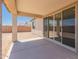 Covered patio with sliding glass doors that offer seamless indoor-outdoor living at 18195 W Hess St, Goodyear, AZ 85338