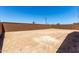 Spacious backyard with dirt and privacy block wall at 18204 W Hess St, Goodyear, AZ 85338