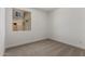 A bright bedroom with neutral carpet and natural light from a window at 18204 W Hess St, Goodyear, AZ 85338