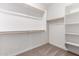 Bright, walk-in closet features adjustable shelving and hanging storage at 18204 W Hess St, Goodyear, AZ 85338