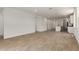 Spacious living area with sleek tile flooring, recessed lighting, and an open floor plan great for entertaining at 18204 W Hess St, Goodyear, AZ 85338