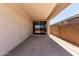 Covered outdoor patio with concrete flooring and sliding glass door at 18204 W Hess St, Goodyear, AZ 85338