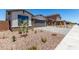 A street view shows desert landscaping, a two-car garage with stone accents, and a paved driveway at 18204 W Hess St, Goodyear, AZ 85338