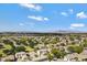 Expansive aerial view of a suburban area featuring a mix of residential homes and a wide open skyscape at 19820 E Reins Rd, Queen Creek, AZ 85142