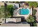 Bird's eye view of a backyard oasis, showcasing a sparkling pool and comfortable outdoor seating at 19820 E Reins Rd, Queen Creek, AZ 85142