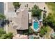 Aerial view of a backyard featuring a private pool, patio area, and lush landscaping at 19820 E Reins Rd, Queen Creek, AZ 85142