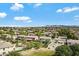 Scenic aerial shot of a neighborhood featuring well-kept homes and a beautiful mountain backdrop at 19820 E Reins Rd, Queen Creek, AZ 85142