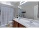 Bathroom featuring double sinks, a large mirror, and a shower-tub combo at 19820 E Reins Rd, Queen Creek, AZ 85142