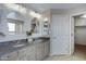 Bathroom featuring double sinks, modern fixtures, and plenty of counter space at 19820 E Reins Rd, Queen Creek, AZ 85142