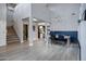 Open-concept space featuring dining area with staircase, adjacent kitchen and living space at 19820 E Reins Rd, Queen Creek, AZ 85142