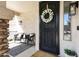 Inviting front porch with comfortable seating, decorative wreath, and a welcoming entrance mat at 19820 E Reins Rd, Queen Creek, AZ 85142