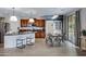 Bright kitchen with granite counters, stainless appliances, and an adjacent dining area at 19820 E Reins Rd, Queen Creek, AZ 85142