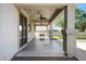 Spacious covered patio with ceiling fans offering the perfect space for outdoor relaxation at 19820 E Reins Rd, Queen Creek, AZ 85142