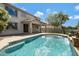 Backyard pool offers a refreshing escape, showcasing the home's exterior and outdoor living space at 19820 E Reins Rd, Queen Creek, AZ 85142