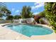 Beautiful pool with water feature and lush landscaping perfect for enjoying the outdoors at 19820 E Reins Rd, Queen Creek, AZ 85142