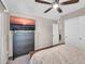 Bedroom with a TV mounted above a dresser and a view of a closet and the doorway at 2049 N 77Th Dr, Phoenix, AZ 85035
