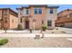 Inviting two-story home featuring desert landscaping and a charming front entrance at 2049 N 77Th Dr, Phoenix, AZ 85035