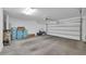 Bright and clean garage featuring ample storage space and an automatic door opener at 2049 N 77Th Dr, Phoenix, AZ 85035