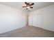 Spacious bedroom with carpet, ceiling fan, and closet at 21817 N 39Th St, Phoenix, AZ 85050