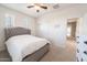 Cozy bedroom featuring carpet, a window, ceiling fan, and closet space at 21817 N 39Th St, Phoenix, AZ 85050