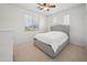 Bedroom featuring neutral walls, carpet, and a large window at 21817 N 39Th St, Phoenix, AZ 85050
