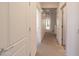 Hallway featuring carpet and multiple doorways at 21817 N 39Th St, Phoenix, AZ 85050