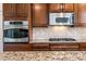 Gourmet kitchen features stainless steel appliances, granite countertops, and ample cabinet space at 21817 N 39Th St, Phoenix, AZ 85050