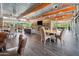 Bright clubhouse lounge with tables, chairs, and stone fireplace offers a comfortable community space at 21817 N 39Th St, Phoenix, AZ 85050