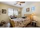 Bright and cozy bedroom featuring a twin bed, decor, and plenty of natural light at 26408 N 53Rd Gln, Phoenix, AZ 85083