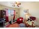 Bedroom featuring a treadmill, accent chair, and ceiling fan at 26408 N 53Rd Gln, Phoenix, AZ 85083