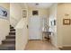 Inviting entryway featuring tile flooring, staircase, and a charming console table at 26408 N 53Rd Gln, Phoenix, AZ 85083
