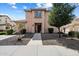 Charming two-story home with desert landscaping and a welcoming walkway to the front door at 26408 N 53Rd Gln, Phoenix, AZ 85083