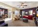Comfortable living room with natural light, plush seating, and open to the dining area at 26408 N 53Rd Gln, Phoenix, AZ 85083