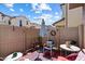 Cozy patio with an umbrella, neutral fencing, and charming decor for relaxing and entertaining outdoors at 26408 N 53Rd Gln, Phoenix, AZ 85083