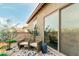 Relaxing balcony with comfortable chairs, offering serene views and a peaceful outdoor space at 27289 N 90Th Ave, Peoria, AZ 85383