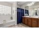 Bathroom with soaking tub and shower at 27289 N 90Th Ave, Peoria, AZ 85383