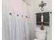 Bathroom with white shower curtain and stylish decorative accents at 27289 N 90Th Ave, Peoria, AZ 85383