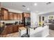 Spacious kitchen boasts granite countertops, breakfast bar, and wood cabinetry at 27289 N 90Th Ave, Peoria, AZ 85383
