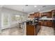 Bright kitchen with eat-in island, granite countertops, and modern appliances at 27289 N 90Th Ave, Peoria, AZ 85383