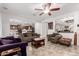 Inviting living room with an open layout, tile floors, and clear views of the kitchen at 27289 N 90Th Ave, Peoria, AZ 85383