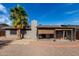 The covered patio is surrounded by a low maintenance yard with desert landscaping at 3106 S Extension Rd, Mesa, AZ 85210