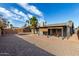 This home features a low maintenance yard with desert landscaping and a covered patio at 3106 S Extension Rd, Mesa, AZ 85210